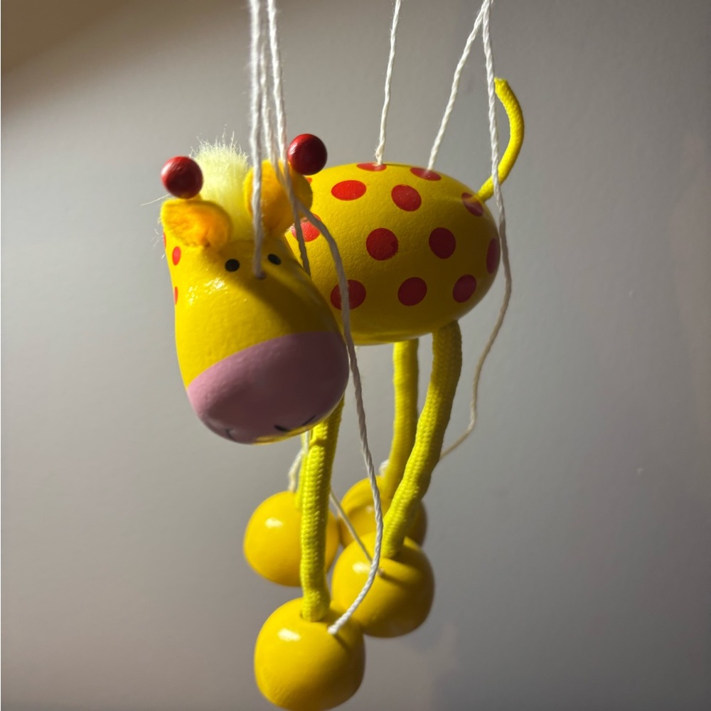 Yellow giraffe marionette